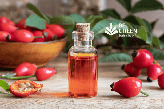 Bottle of rosehip oil and rosehips