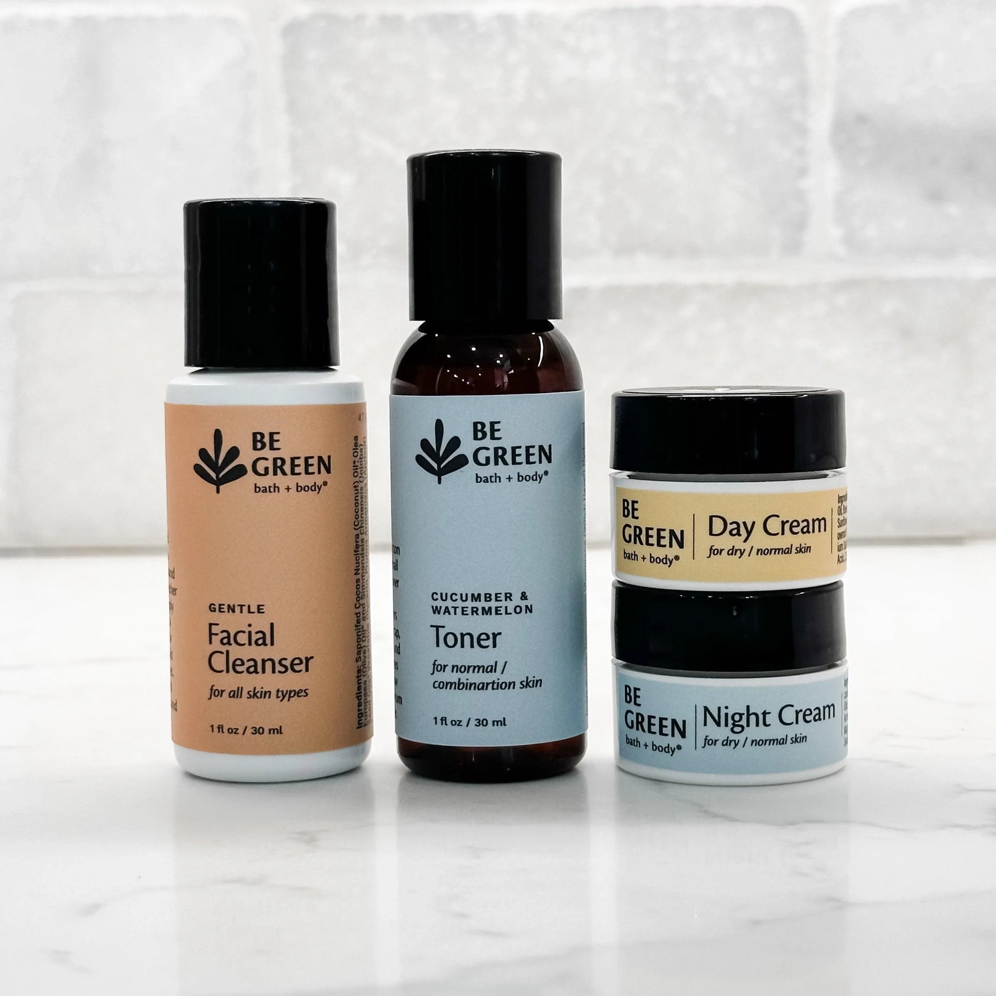 Travel size green skincare products for face.