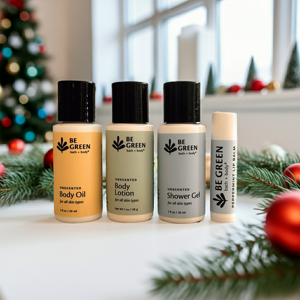 Set of 'Be Green' bath and body products with Christmas decorations in the background