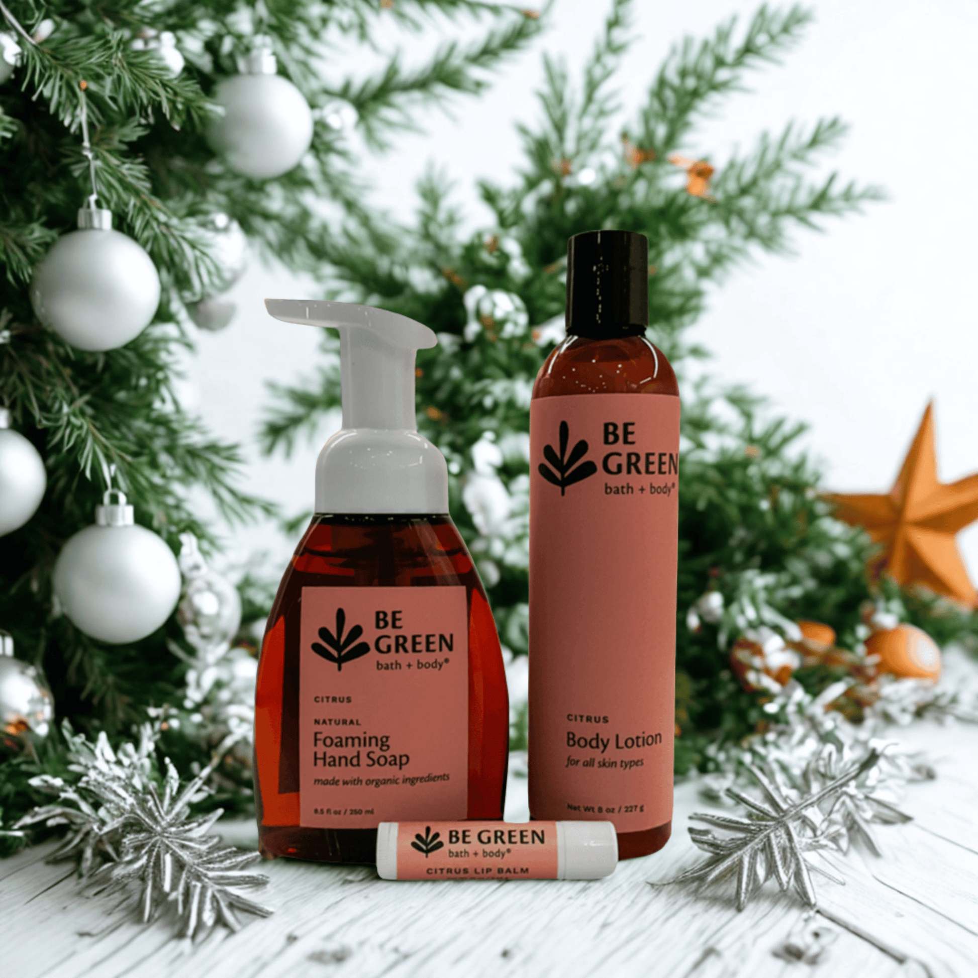 Be Green bath & body products with Christmas tree and decorations in the background