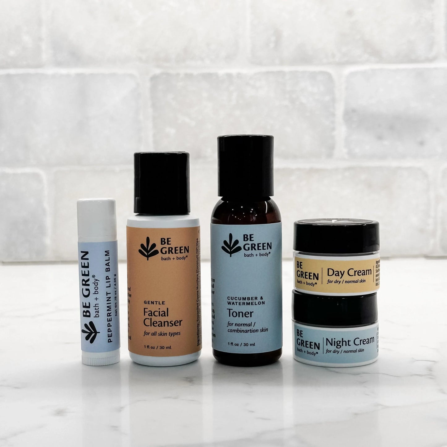 EWG Verified skincare gift set:  travel size facial cleanser, toner, day cream, night cream, lip balm.