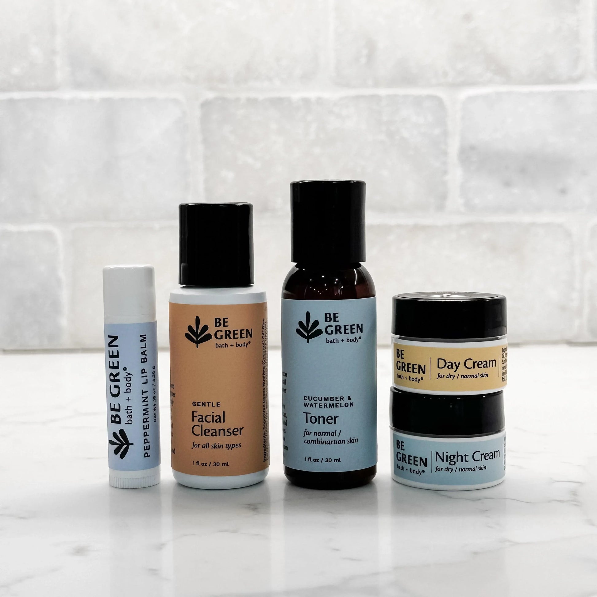 EWG Verified skincare gift set:  travel size facial cleanser, toner, day cream, night cream, lip balm.