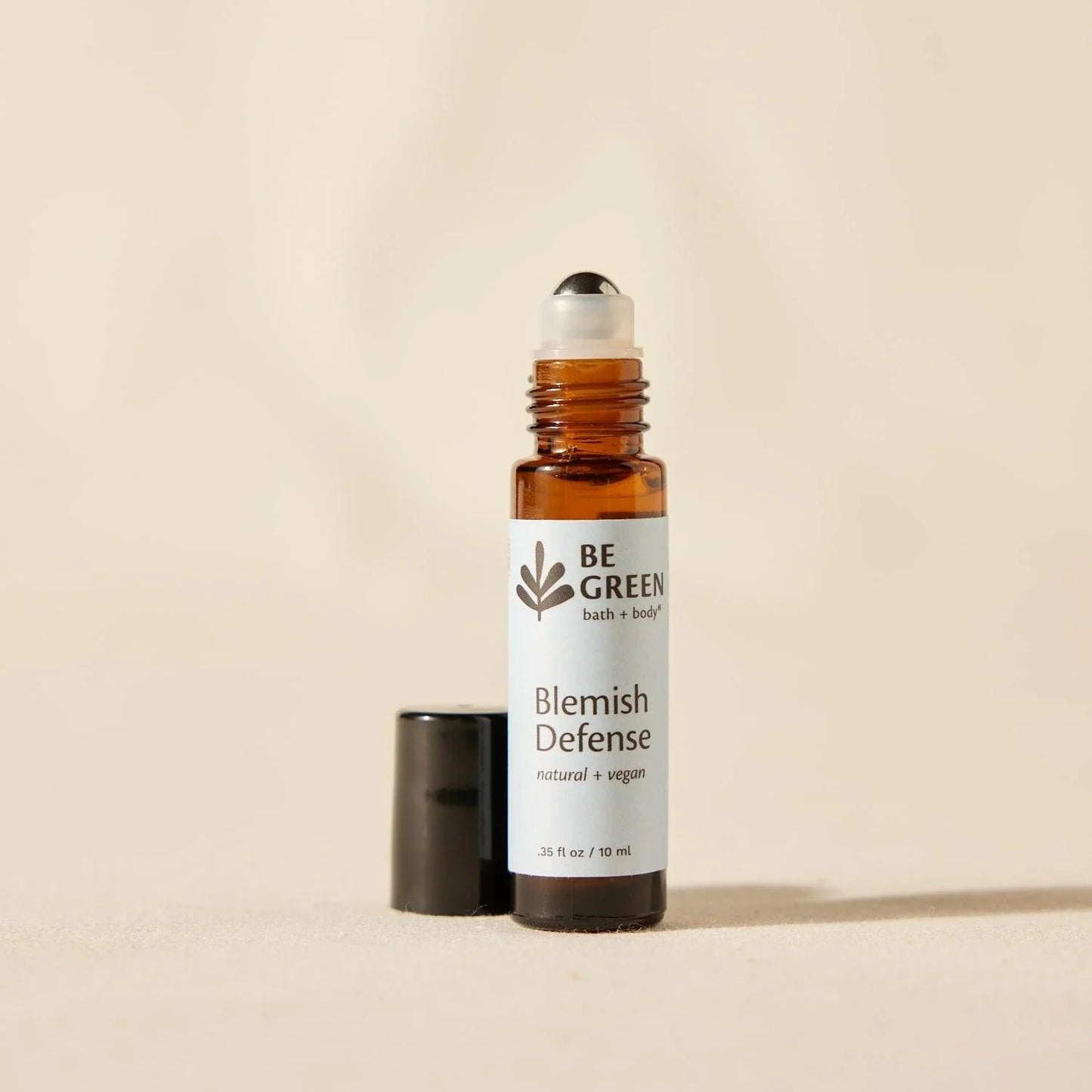 Blemish and spot reducer in a glass roller ball bottle.