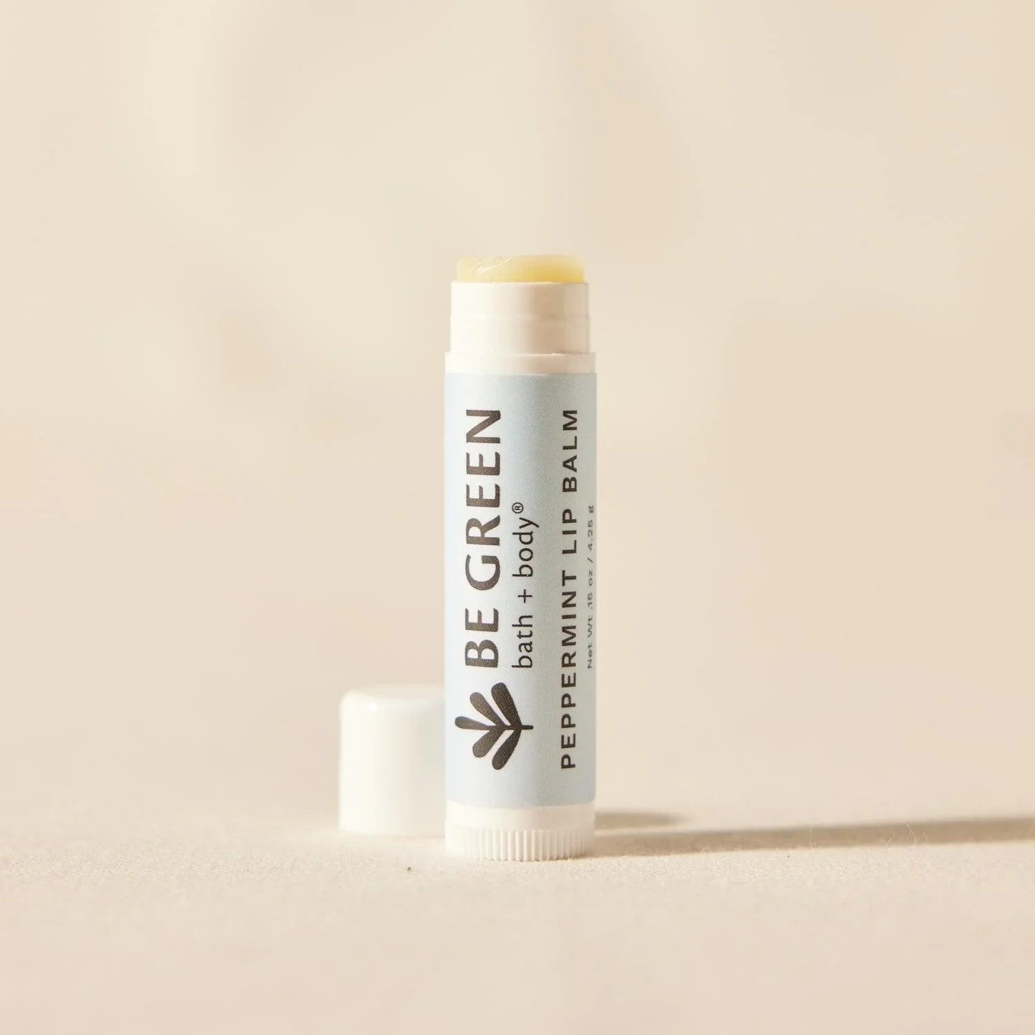 Petroleum free lip balm with essential oils.  EWG Verified. Cap off.