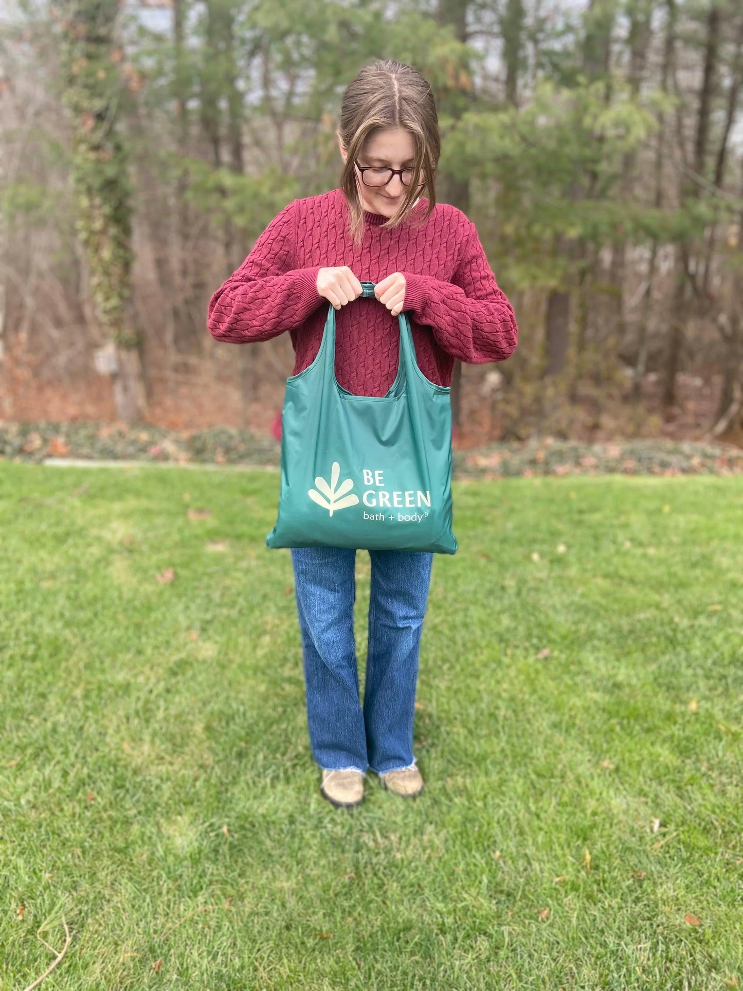 Be Green reusable tote bag. Model shows size.