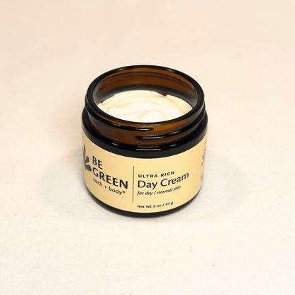 Ultra rich day cream open jar in amber glass