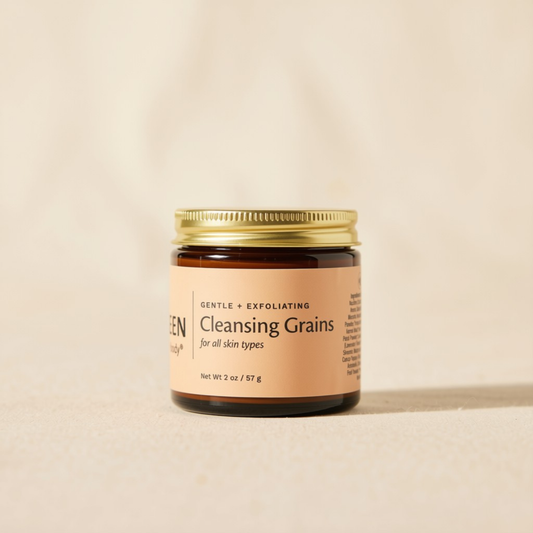 A jar of Botanical Cleansing Grains with a gold lid.