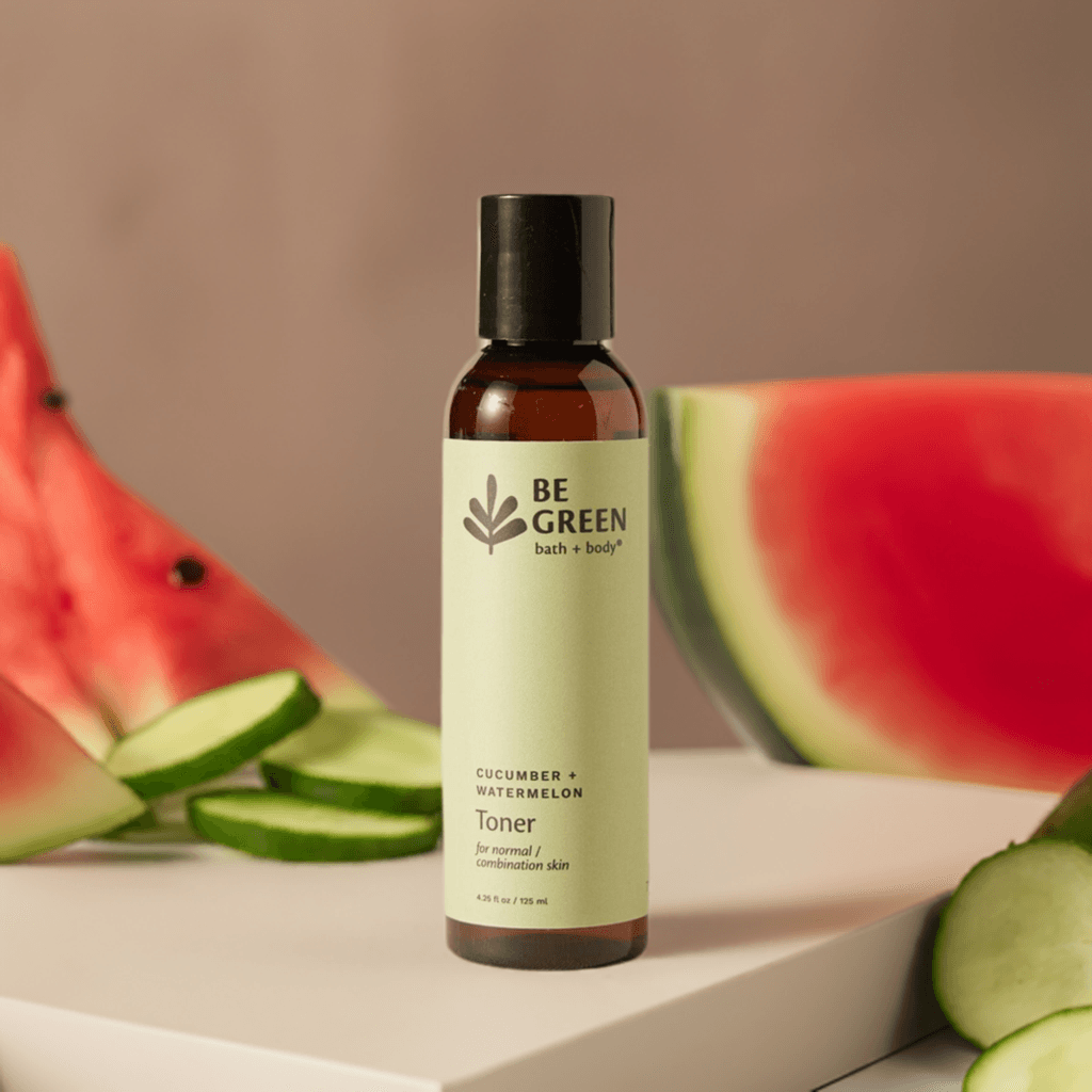 Cucumber + Watermelon Toner on a light stone platform