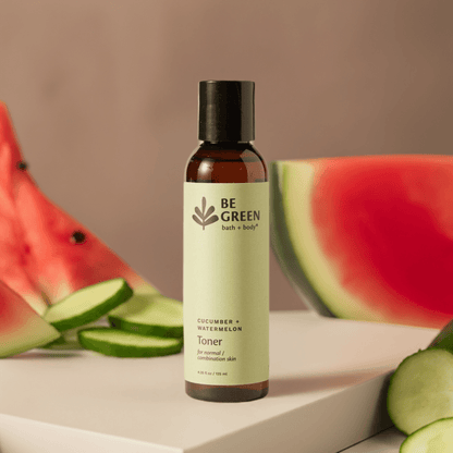 Cucumber + Watermelon Toner on a light stone platform