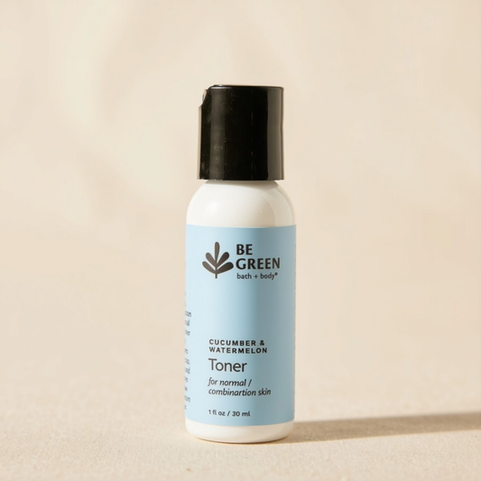 A 30 ml bottle of BE GREEN Cucumber & Watermelon Toner, featuring a white bottle, a light blue label, and a black cap, set against a warm beige background.