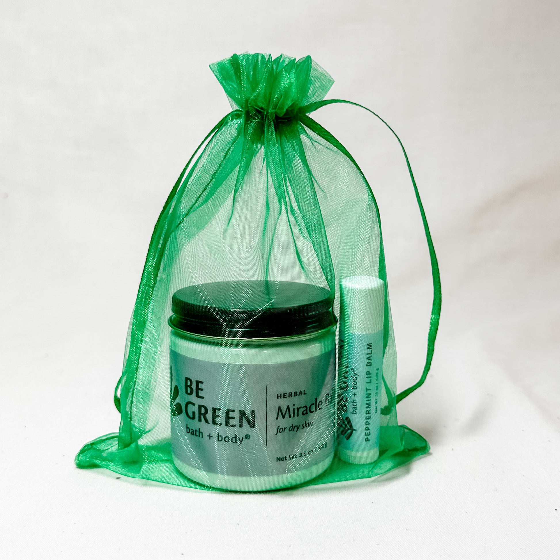 Miracle Balm and Lip Balm Gift Set in a green gift bag