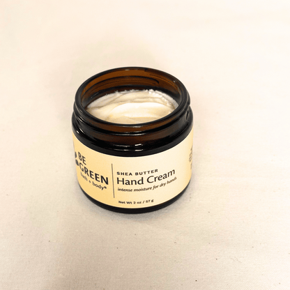 Shea Butter Hand Cream in an open amber glass jar