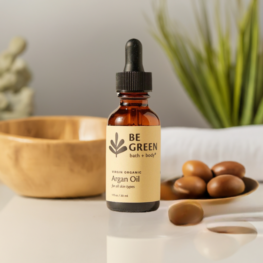 Argan Oil Facial Oil Serum on a counter with argan nuts