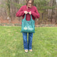 Be Green reusable tote bag.  Model shows size.